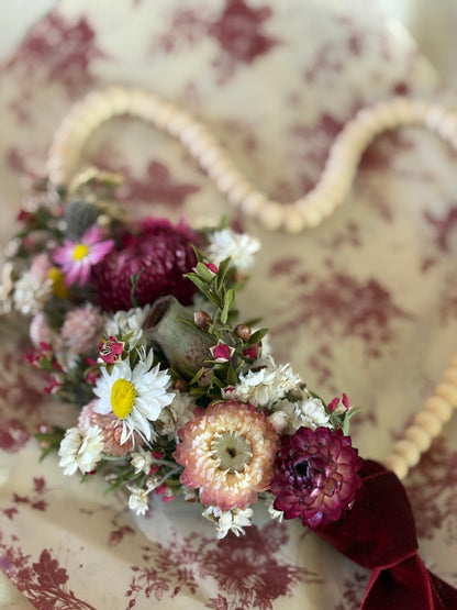 Floral arrangement on a textured surface with a decorative pattern. handmade gift