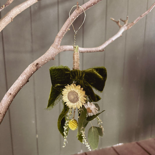 Native hanging Christmas decoration of everlasting daisies, kangaroo paw, grevillea and billy buttons with velvet ribbon