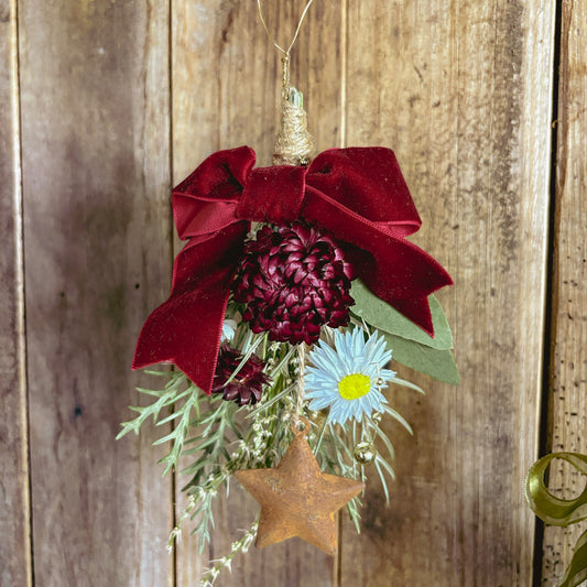 Close-up of a hand-tied native hanging decoration with velvet ribbon
