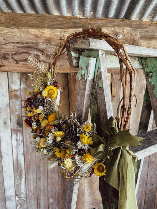 Banksia wreath on a natural vine base, made with dried Australian native flowers