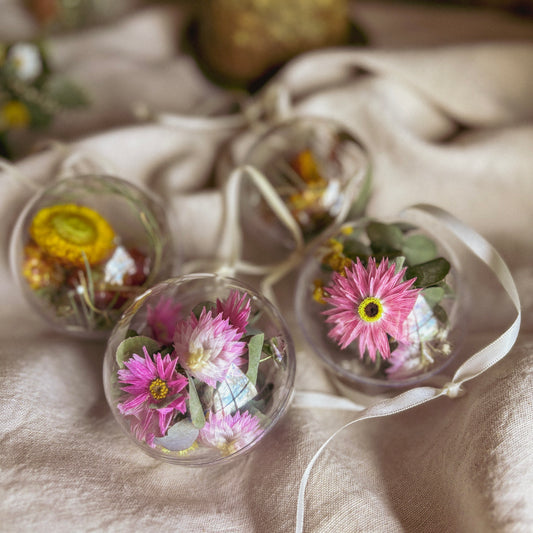 Botanical Christmas bauble filled with dried everlasting daisies and Australian native flowers